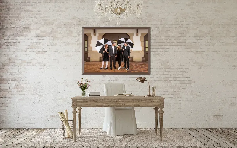 A framed portrait in a white bathroom